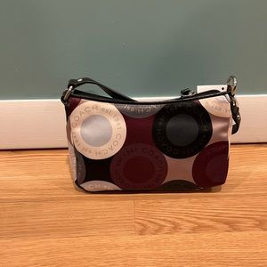 Coach - Selling together - wristlets and bag. Slightly used, look brand new.
